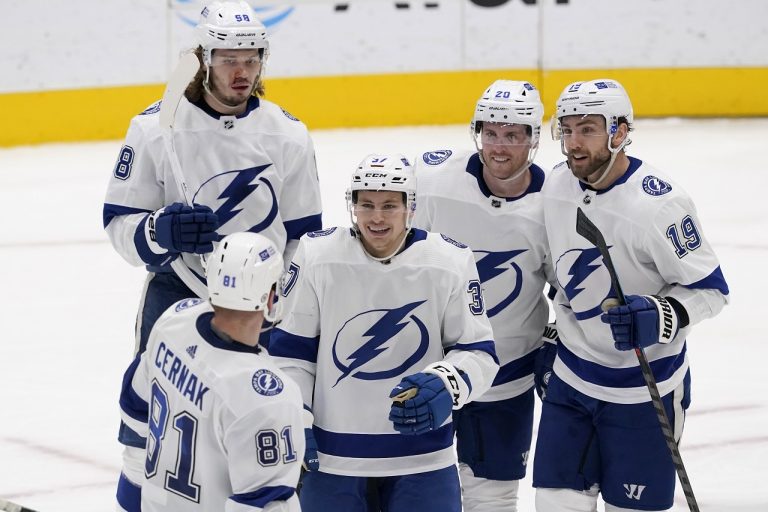 Erik Cernak (81), Mikhail Sergachev (98), Blake Coleman (20) and Barclay Goodrow (19) celebrate with Yanni Gourde (37)